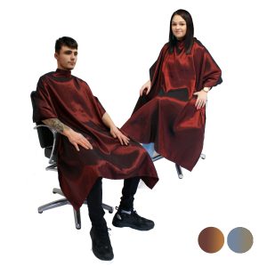 Two models, one male and one female, wearing Hair Tools Two-Tone Unisex Cutting Gowns in Burgundy, with digital swatches showing other colours available