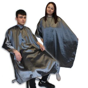 Two models, one male and one female, wearing Hair Tools Two-Tone Unisex Cutting Gowns in Gunmetal